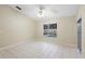 Bright living room with vaulted ceilings and a view of the screened pool area at 2304 Clementine Trl, Clermont, FL 34714