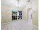 Living room with tile floor, lots of natural light and neutral-colored walls at 2304 Clementine Trl, Clermont, FL 34714