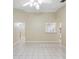 Open-concept living room with tile flooring, neutral paint, and natural light at 2304 Clementine Trl, Clermont, FL 34714