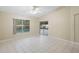 Sun-filled living room with tile flooring, a pool view, and sliding glass door access at 2304 Clementine Trl, Clermont, FL 34714