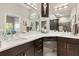 Bright bathroom boasts dual sinks, updated fixtures, and ample counter space for convenience at 2325 Kenya St, The Villages, FL 32162