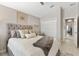 Comfortable bedroom featuring a closet, vaulted ceiling, and inviting decor at 2325 Kenya St, The Villages, FL 32162