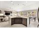 Bright open-concept kitchen with modern appliances, sleek countertops, and breakfast bar for easy entertaining at 2325 Kenya St, The Villages, FL 32162