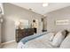 Comfortable and luxurious main bedroom featuring plush bedding and ensuite bathroom at 2325 Kenya St, The Villages, FL 32162
