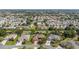 An aerial view displays the uniformity and planned nature of this residential area with lush landscaping at 2348 Riley Rd, The Villages, FL 32162