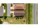 Aerial view of a well-maintained single-story home with a brown roof and manicured landscaping at 2348 Riley Rd, The Villages, FL 32162