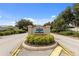 Entrance to Village of Ashland and Lynnhaven with lush landscaping and signage at 2348 Riley Rd, The Villages, FL 32162