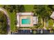 Aerial view of the community pool, shuffleboard and seating areas with parking at 2348 Riley Rd, The Villages, FL 32162