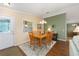 Inviting dining room featuring wood floors, a chandelier, and neutral paint at 2348 Riley Rd, The Villages, FL 32162
