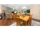Inviting dining room featuring wood floors and natural light, perfect for Gathering meals at 2348 Riley Rd, The Villages, FL 32162
