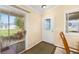 An inviting entryway offering natural light, wood floors, and access to a screened lanai at 2348 Riley Rd, The Villages, FL 32162