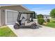 Golf cart parked in front of garage at 2348 Riley Rd, The Villages, FL 32162