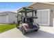 Rear of golf cart parked in front of garage at 2348 Riley Rd, The Villages, FL 32162