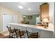 Spacious kitchen with bar seating, offering a bright and airy feel at 2348 Riley Rd, The Villages, FL 32162