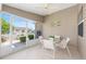 Comfortable screened-in lanai featuring seating and a great view of the garden at 2348 Riley Rd, The Villages, FL 32162