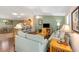 A cozy living room offers a relaxing area, with a serene color scheme and hardwood flooring at 2348 Riley Rd, The Villages, FL 32162