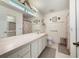 Bright bathroom featuring a long vanity, toilet, and shower/tub combination at 239 Juniper Way, Tavares, FL 32778