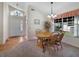 Inviting dining area with a wooden table, and a sunlit window, great for Gathering gatherings at 239 Juniper Way, Tavares, FL 32778