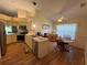 Open kitchen with a breakfast nook, stainless steel appliances, and plenty of storage at 239 Juniper Way, Tavares, FL 32778