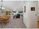 Spacious living room featuring carpet flooring, a ceiling fan, and large windows offering natural light at 239 Juniper Way, Tavares, FL 32778