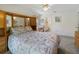 Relaxing main bedroom with built-in storage and a view into the attached bathroom at 239 Juniper Way, Tavares, FL 32778