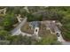 Charming single Gathering home with well-maintained yard and a long private driveway nestled among mature trees at 254 Locust Pass Dr, Ocala, FL 34472
