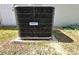 View of the air conditioning unit sitting on a concrete pad outside the home at 254 Locust Pass Dr, Ocala, FL 34472