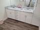 Bathroom featuring double sink vanity with marble countertop at 254 Locust Pass Dr, Ocala, FL 34472