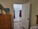Walk-in closet with wooden floors and hanging clothes and storage shelves at 254 Locust Pass Dr, Ocala, FL 34472
