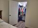 Walk-in closet with organized shelving and rods for optimal storage and organization at 254 Locust Pass Dr, Ocala, FL 34472