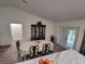 Inviting dining space with a table and chairs, seamlessly connected to the kitchen area at 254 Locust Pass Dr, Ocala, FL 34472