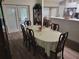 Bright dining space with patio access, a dining table, and seamless flow to the kitchen area at 254 Locust Pass Dr, Ocala, FL 34472