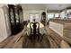 Formal dining room with a large table, china cabinet, and views into the kitchen at 254 Locust Pass Dr, Ocala, FL 34472