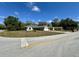Corner lot with a single-story home and an attached two-car garage at 254 Locust Pass Dr, Ocala, FL 34472