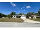 Charming single-story home with a well-maintained lawn and an attached two-car garage at 254 Locust Pass Dr, Ocala, FL 34472