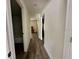 Hallway providing access to the bathroom and bedrooms at 254 Locust Pass Dr, Ocala, FL 34472
