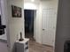 Hallway leading to a bedroom, featuring a lighthouse decor piece at 254 Locust Pass Dr, Ocala, FL 34472