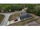 Birds eye view of single Gathering home featuring a well-maintained exterior, a long private driveway, and mature trees at 254 Locust Pass Dr, Ocala, FL 34472