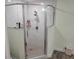 Modern shower featuring marble tiling, a glass door, and dual shower heads at 254 Locust Pass Dr, Ocala, FL 34472
