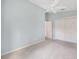 This cozy bedroom has carpeted floors and sliding closet doors at 2564 Red Cedar Ln, The Villages, FL 32162
