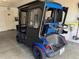 This rear view of this custom golf cart features a Yamaha logo, custom wheels, and a functional rear cargo area at 2564 Red Cedar Ln, The Villages, FL 32162