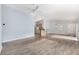 Bright living room featuring hardwood flooring, light blue walls, and a ceiling fan at 2564 Red Cedar Ln, The Villages, FL 32162
