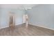 Spacious primary bedroom with ceiling fan and ensuite bathroom with tile flooring at 2564 Red Cedar Ln, The Villages, FL 32162