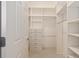 Custom walk-in closet with built-in drawers and shelving for optimal organization at 2564 Red Cedar Ln, The Villages, FL 32162