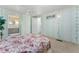 Bedroom featuring pale green walls, carpet flooring, and a ceiling fan, with an ensuite bathroom at 2706 Vindale Rd, Tavares, FL 32778