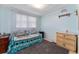 Charming bedroom with a daybed, a window with sheer curtains, and cozy decor at 2706 Vindale Rd, Tavares, FL 32778