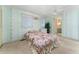 Bedroom featuring pale green walls, carpet flooring, two closets, and a ceiling fan at 2706 Vindale Rd, Tavares, FL 32778