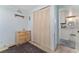 Bedroom with a dresser, a closet, and access to the kitchen showcasing a blend of living spaces at 2706 Vindale Rd, Tavares, FL 32778