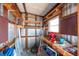 Spacious storage area with workbench, shelving, and ample room for tools and equipment at 2706 Vindale Rd, Tavares, FL 32778
