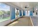 Inviting sunroom with large windows and bright, airy feel, perfect for relaxing and enjoying the view at 2706 Vindale Rd, Tavares, FL 32778